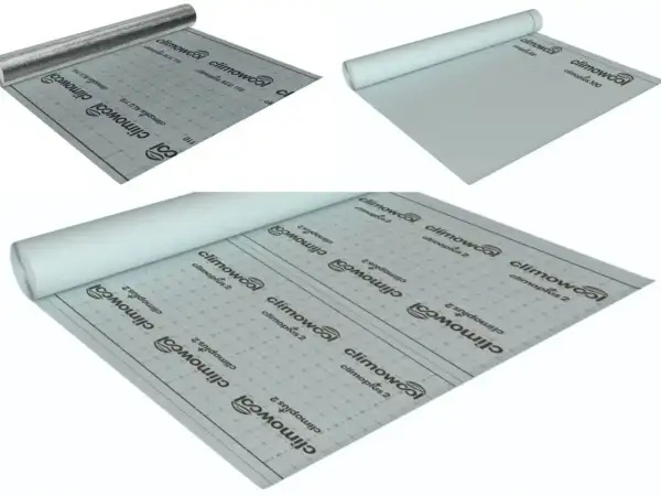 Rolki materiału budowlanego, w tym paroizolacja z aluminiową warstwą odbijającą ciepło.